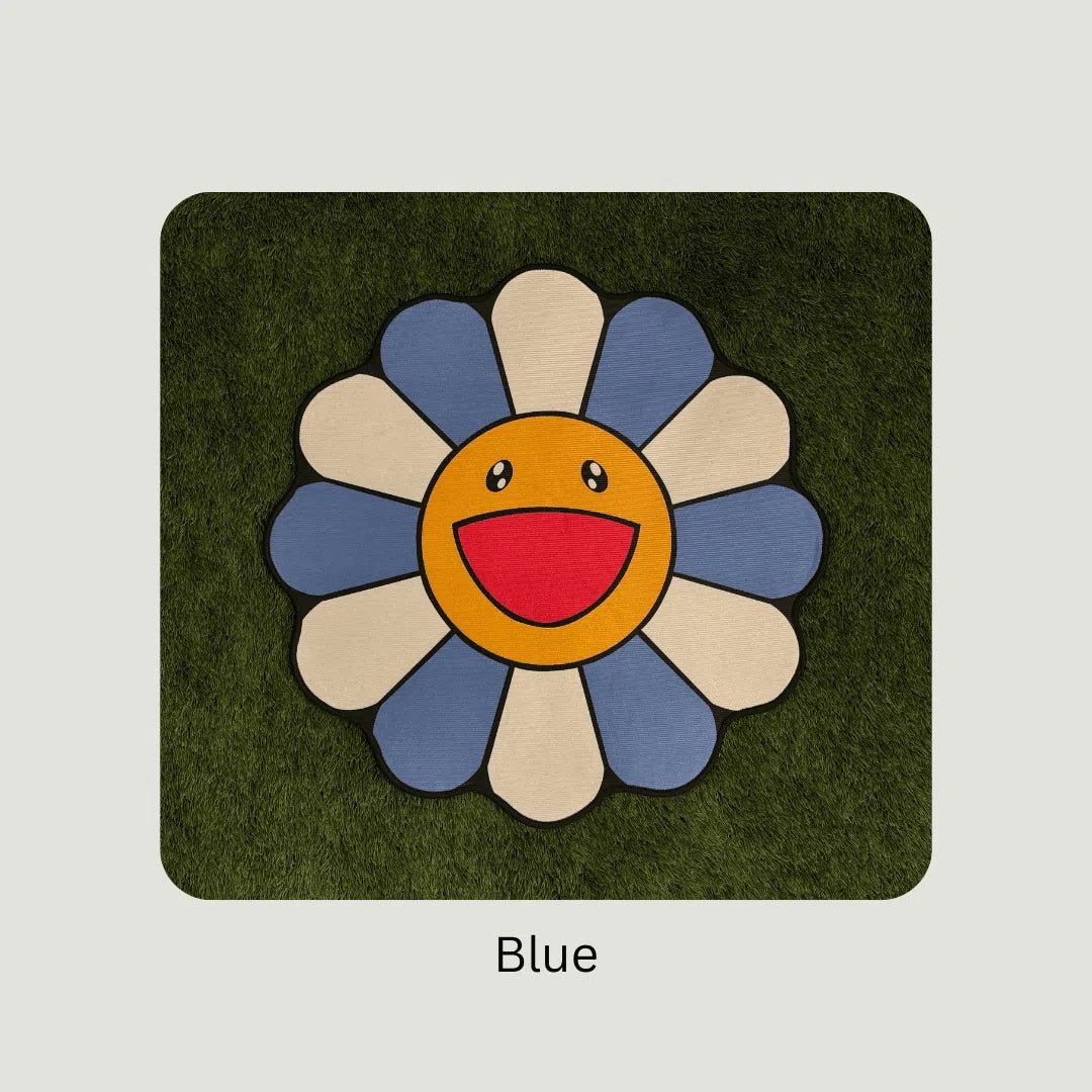 Blue Murakami Flower Rugs styled on turf in multiple sizes to showcase scale and bold color impact.