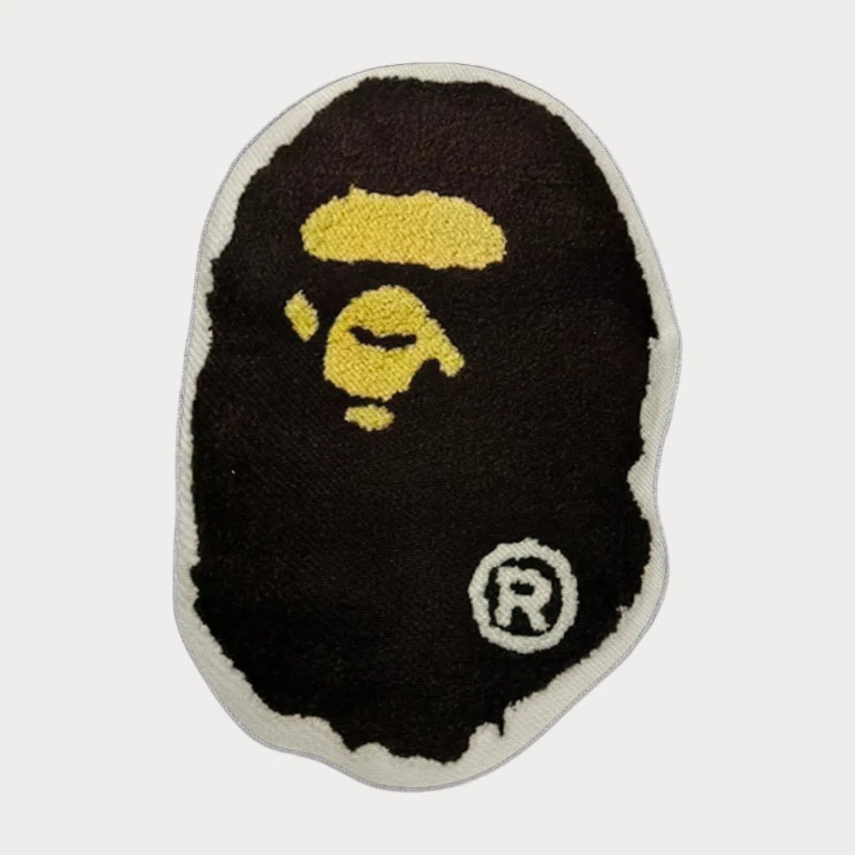 Classic BAPE Rug with iconic BAPE head design, laid flat against a neutral background.