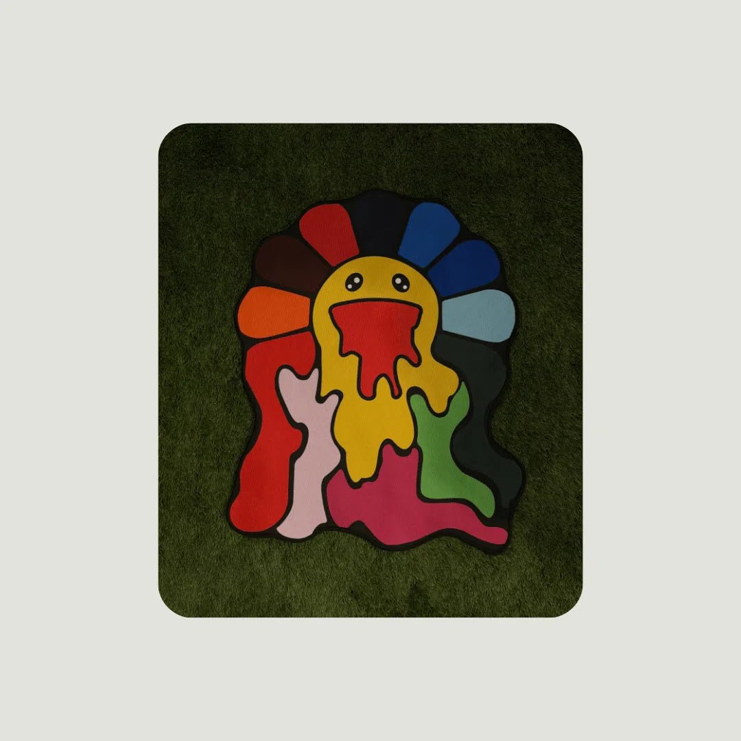 Drippy Rainbow Flower Rugs displayed on green turf in all three sizes for visual scale and styling.