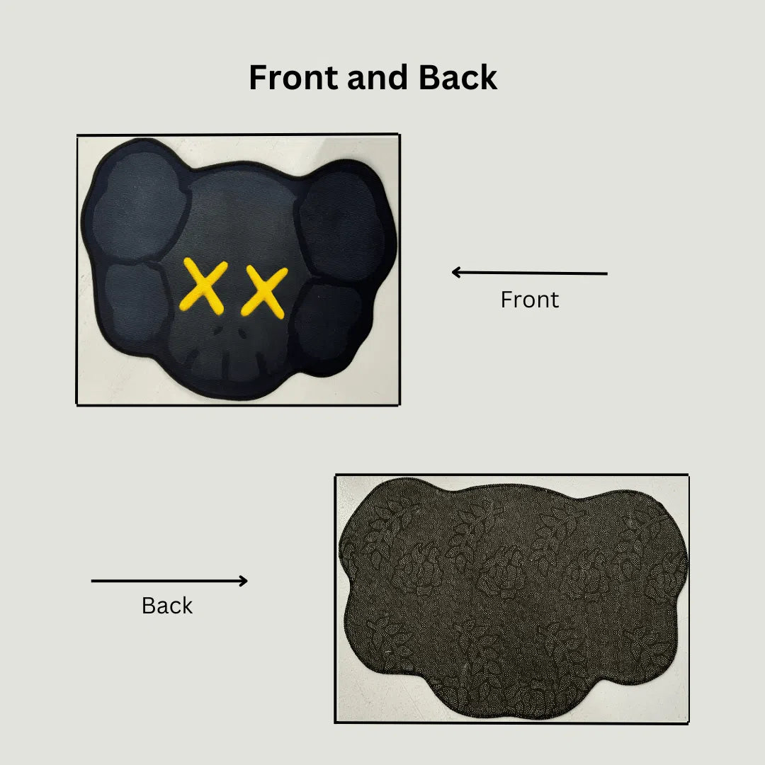 Side-by-side image of the KAWS rug front design with gold and the anti-slip backing for floor grip.