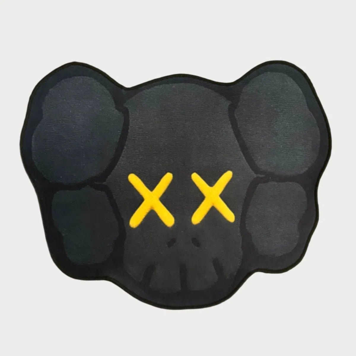 KAWS Head Rug with gold accent details, laid flat to showcase the concealed face design.