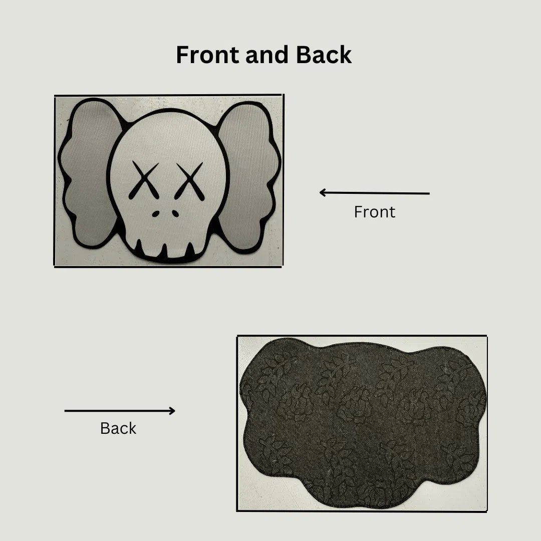 Dual image showing top KAWS design and bottom non-slip rubber backing of the grey tone rug.