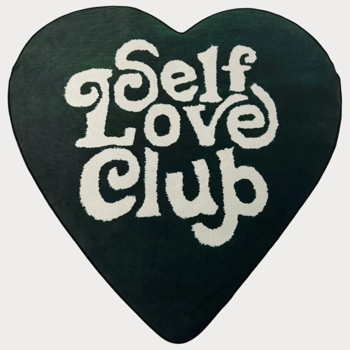 Self Love Club Rug featuring a green heart with bold text, laid flat on a clean white background.