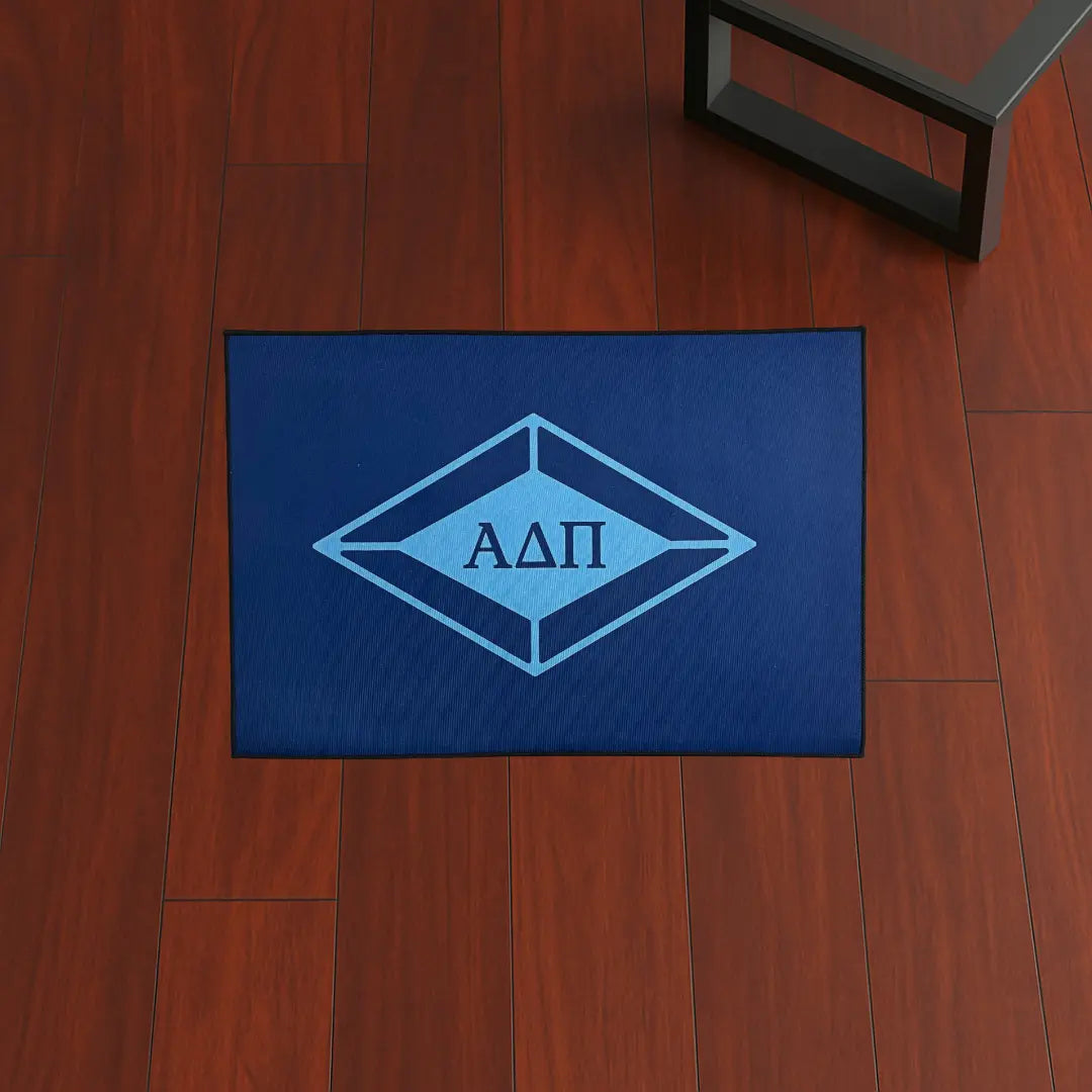 Alpha Delta Pi Letters Style | 3x2 ft Custom Rug by Sirenicate Rugs, prominently displayed on a vibrant dark hardwood floor background.