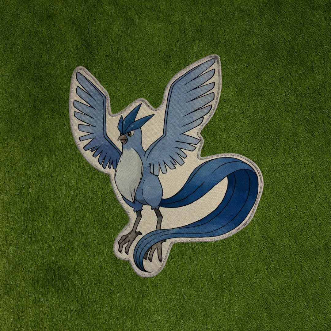 Articuno Rug – Ice Blue Legendary Bird Rug Design custom rug by Sirenicate Rugs, prominently displayed on a vibrant dark green turf background.