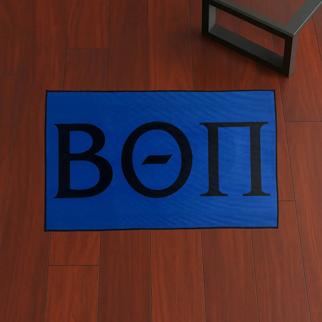 Custom Rug – Beta Theta Pi Letters Blue custom rug by Sirenicate Rugs, prominently displayed on a vibrant dark hardwood floor background.