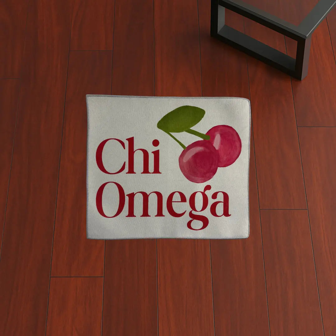 Custom Rug – Chi Omega Cherry Design custom rug by Sirenicate Rugs, prominently displayed on a vibrant dark hardwood floor background.
