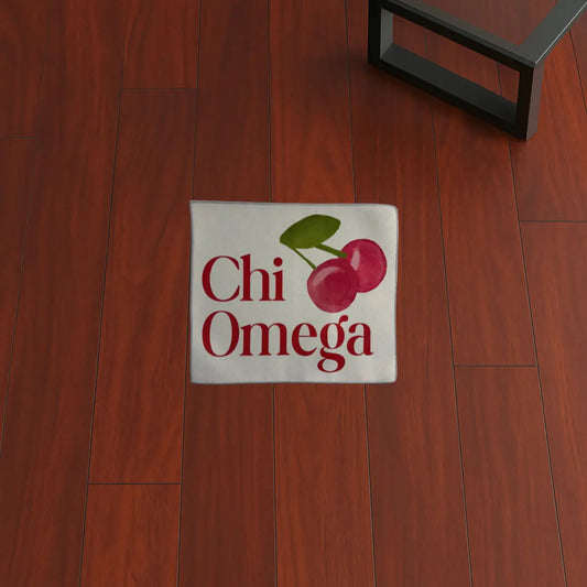 Custom Rug – Chi Omega Cherry Design custom rug by Sirenicate Rugs, prominently displayed on a vibrant dark hardwood floor background