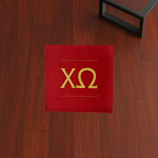 Custom Rug – Chi Omega Greek Letters Red & Yellow custom rug by Sirenicate Rugs, prominently displayed on a vibrant dark hardwood floor background.