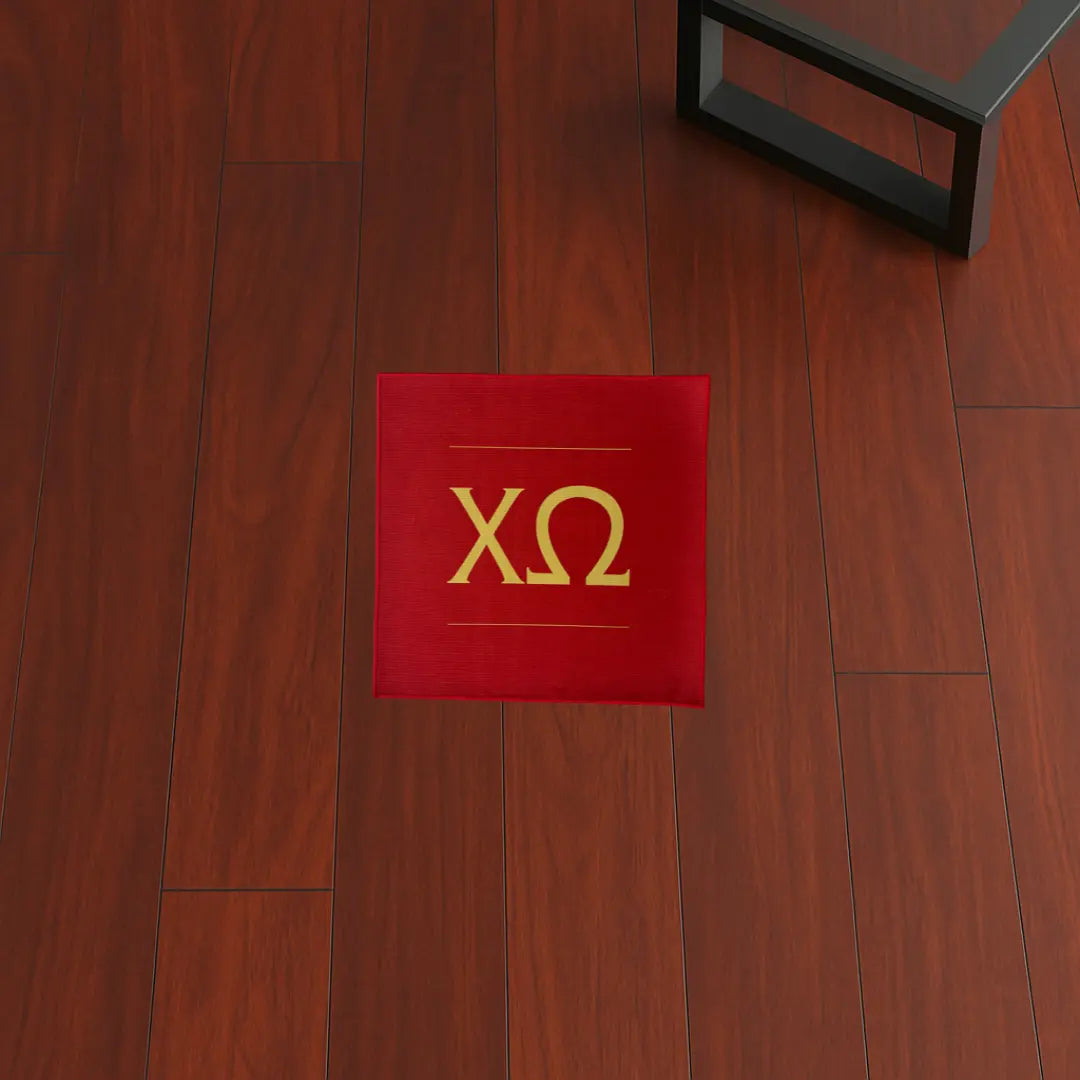 Custom Rug – Chi Omega Greek Letters Red & Yellow custom rug by Sirenicate Rugs, prominently displayed on a vibrant dark hardwood floor background.