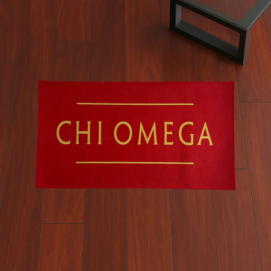 Custom Area Rug – Chi Omega Red & Yellow Large custom rug by Sirenicate Rugs, prominently displayed on a vibrant dark hardwood floor background.