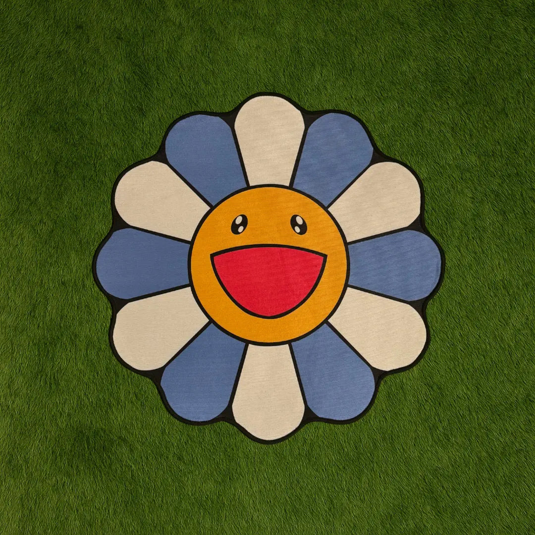 Custom Rug – Blue Murakami Flower Rug custom rug by Sirenicate Rugs, prominently displayed on a vibrant dark green turf background.