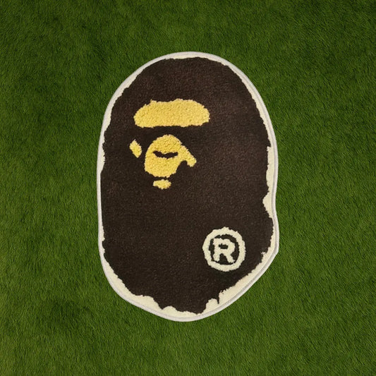 Custom Rug - Classic BAPE Streetwear Design custom rug by Sirenicate Rugs, prominently displayed on a vibrant dark green turf background.