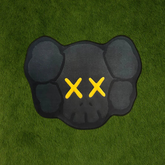 Custom Rug – KAWS Head Gold Accent Edition custom rug by Sirenicate Rugs, prominently displayed on a vibrant dark green turf background.