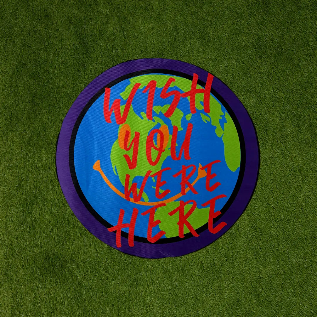 Custom Rug - Wish You Were Here custom rug by Sirenicate Rugs, prominently displayed on a vibrant dark green turf background.