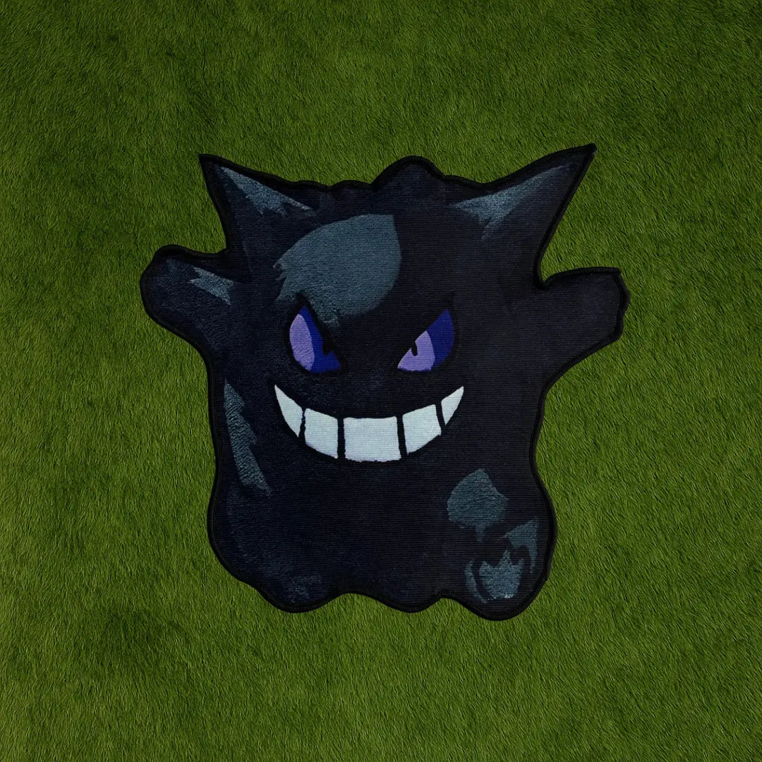 Gengar Rug – Black Shadow Design Custom Rug for Pokémon Fans custom rug by Sirenicate Rugs, prominently displayed on a vibrant dark green turf background.