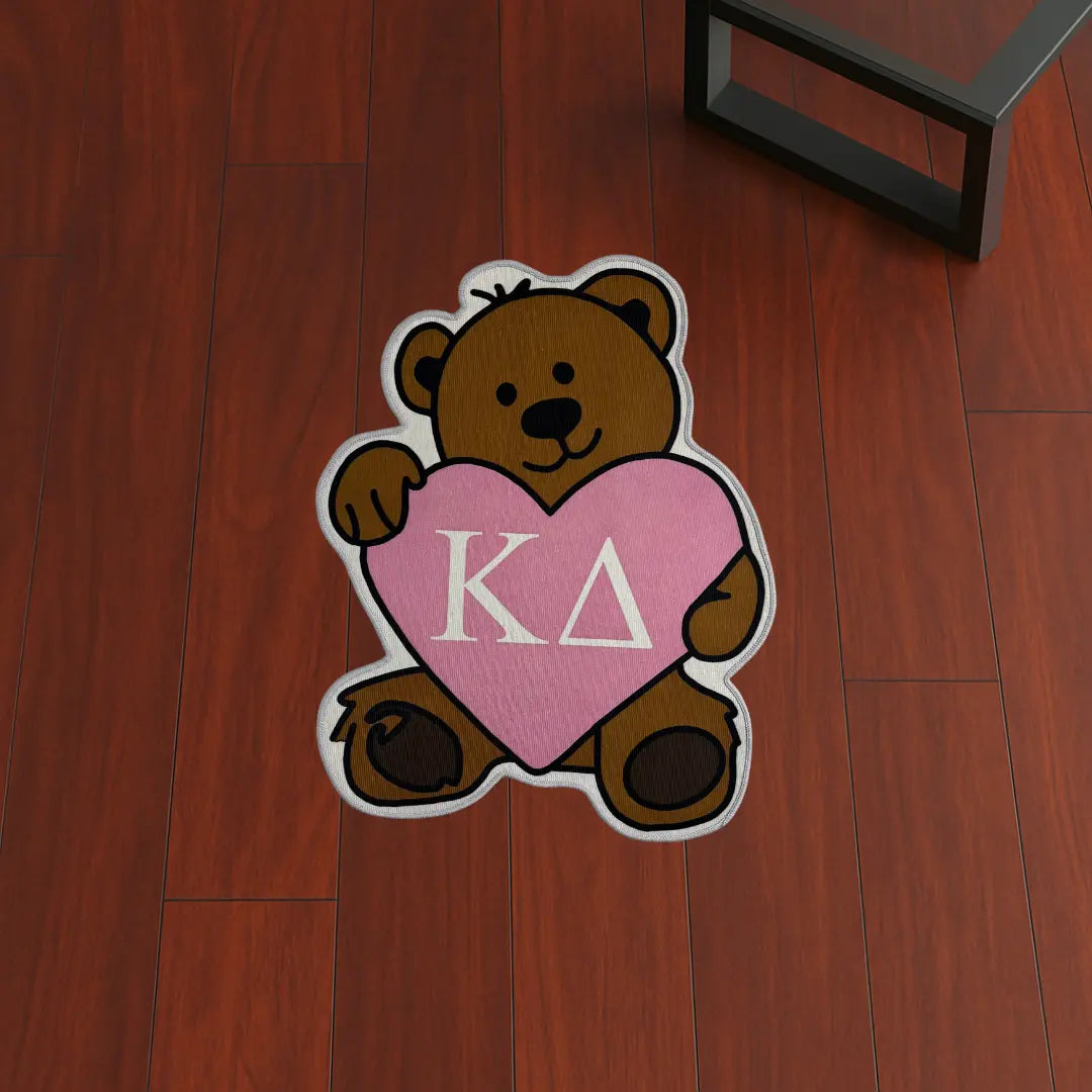 Custom Rug – Kappa Delta Bear Style custom rug by Sirenicate Rugs, prominently displayed on a vibrant dark hardwood floor background.