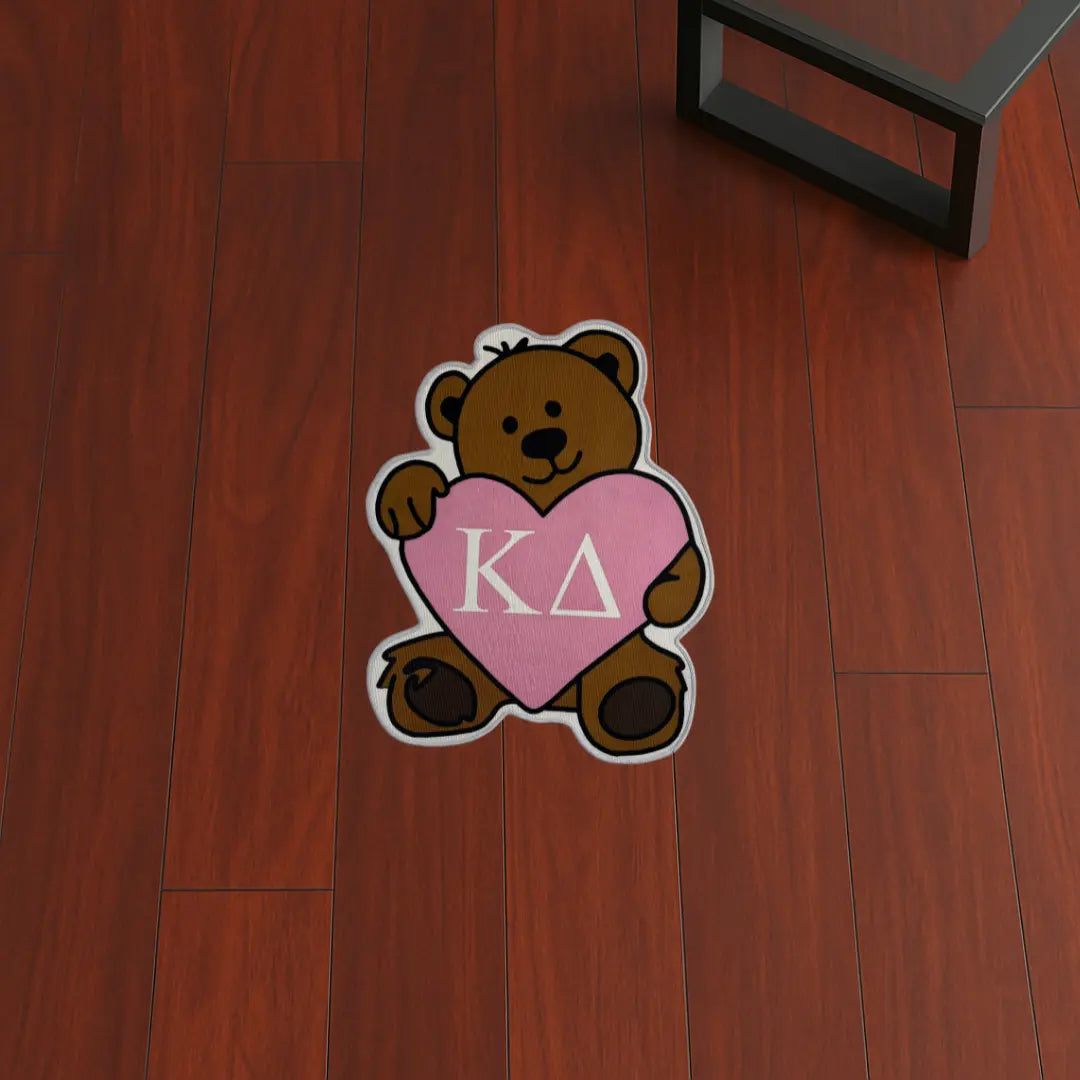 Custom Rug – Kappa Delta Bear Style custom rug by Sirenicate Rugs, prominently displayed on a vibrant dark hardwood floor background.