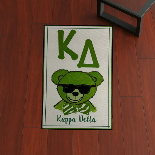 Custom Rug – Kappa Delta Green Bear custom rug by Sirenicate Rugs, prominently displayed on a vibrant dark hardwood floor background.