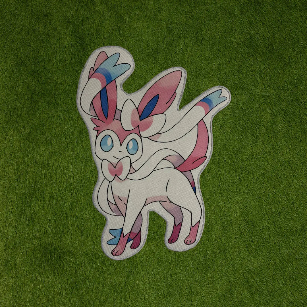 Sylveon Rug – Pink Eevee Evolution Rug for Pokémon Fans custom rug by Sirenicate Rugs, prominently displayed on a vibrant dark green turf background.