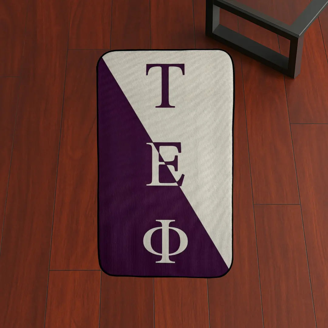 Custom Rug – Tau Epsilon Phi Flag Design custom rug by Sirenicate Rugs, prominently displayed on a vibrant dark hardwood floor background.