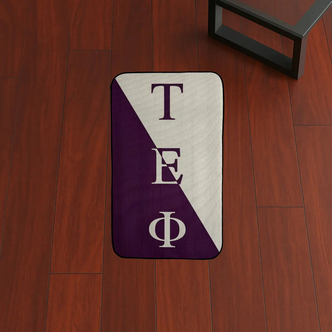 Custom Rug – Tau Epsilon Phi Flag Design custom rug by Sirenicate Rugs, prominently displayed on a vibrant dark hardwood floor background.