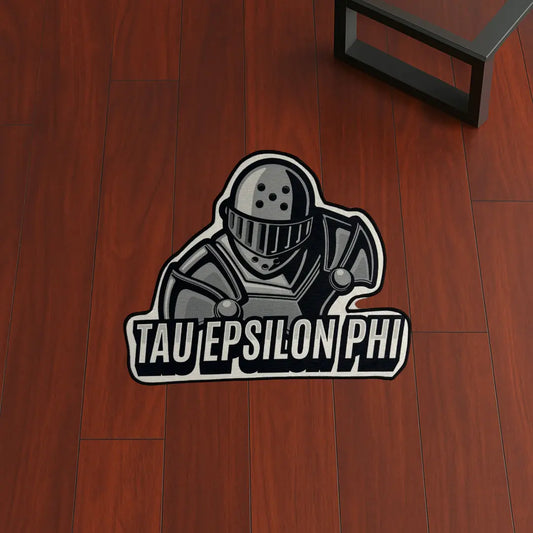 Custom Rug – Tau Epsilon Phi Knight Design custom rug by Sirenicate Rugs, prominently displayed on a vibrant dark hardwood floor background.