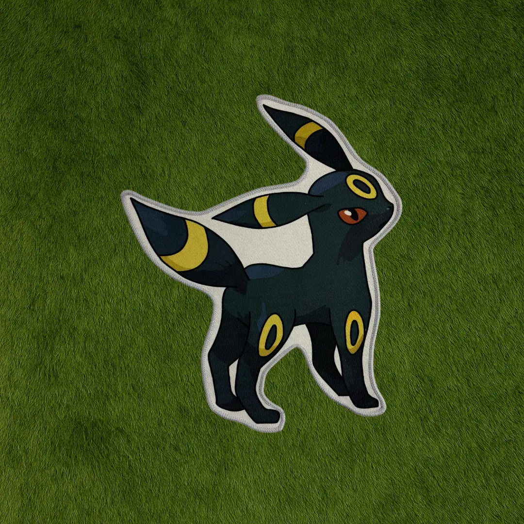 Umbreon Rug – Limited Edition Eevee Evolution Rug custom rug by Sirenicate Rugs, prominently displayed on a vibrant dark green turf background.