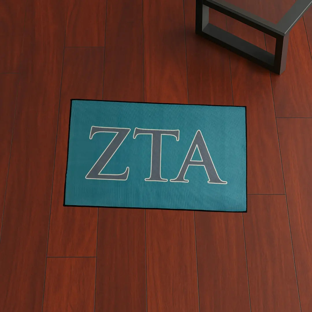 ZETA Sorority Letters Decor | 3x2 ft Custom Rug by Sirenicate Rugs, prominently displayed on a vibrant dark hardwood floor background.