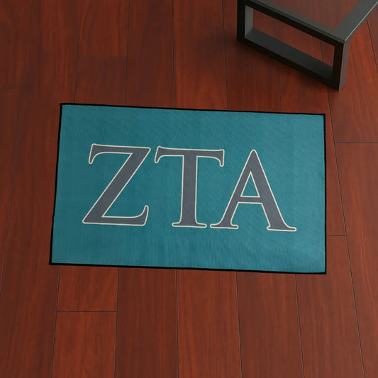 ZETA Sorority Letters Decor | 4x2.5 ft Custom Rug by Sirenicate Rugs, prominently displayed on a vibrant dark hardwood floor background.