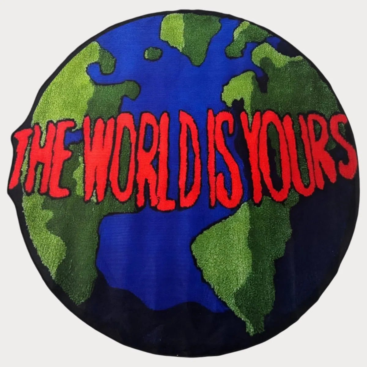 The World Is Yours Rug with minimalist world map design in black and white, laid flat on a clean surface.