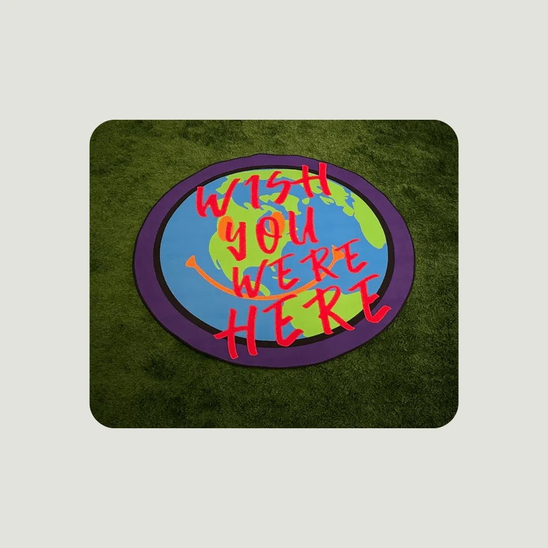 “Wish You Were Here” Rugs placed on turf in different sizes, showing visual texture and color vibrancy.