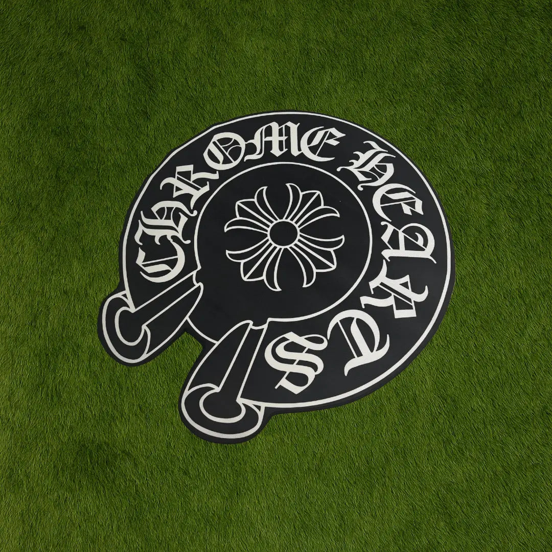 Custom Chrome Hearts Circle Rug – Designer-Style Area Rug (140x131 cm) custom rug by Sirenicate Rugs, prominently displayed on a vibrant dark green turf background.