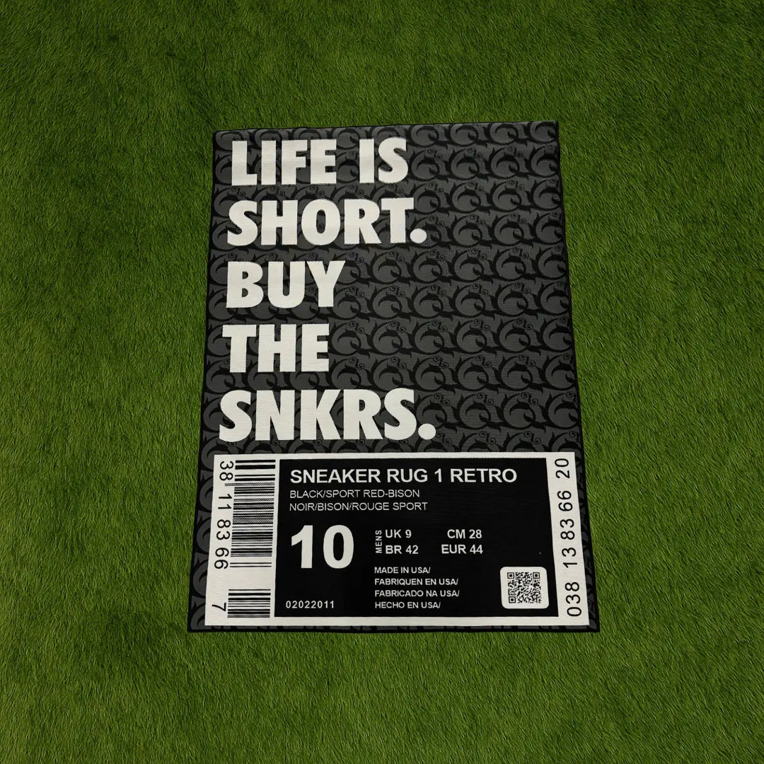 Custom Rug - Sneaker Box OG Black Edition custom rug by Sirenicate Rugs, prominently displayed on a vibrant dark green turf background.