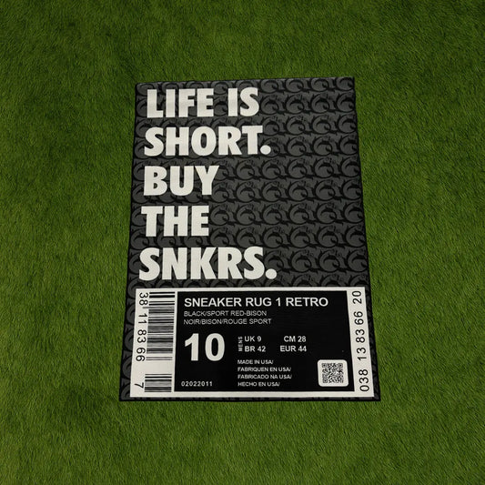 Custom Rug - Sneaker Box OG Black Edition custom rug by Sirenicate Rugs, prominently displayed on a vibrant dark green turf background.