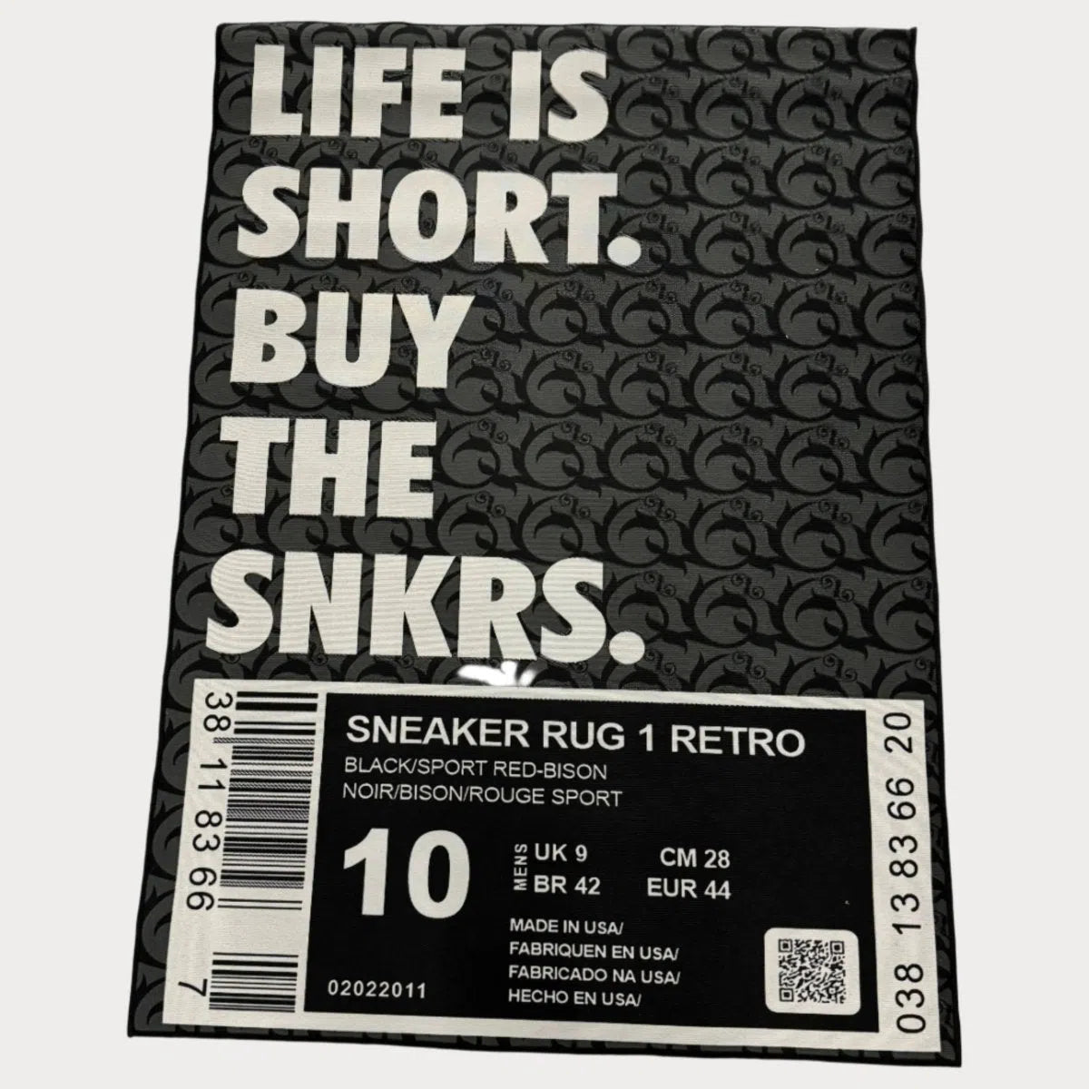 Sneaker Box Rug in classic black with label-style design, laid flat on a clean backdrop.